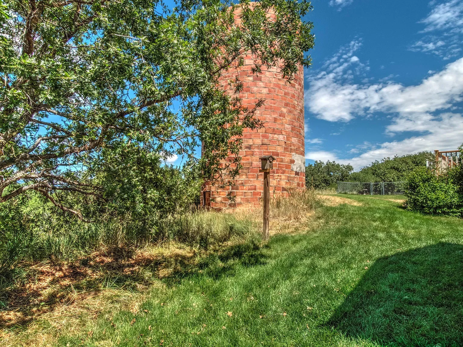 Random brick silo in the yard. Anyone know the story behind this?