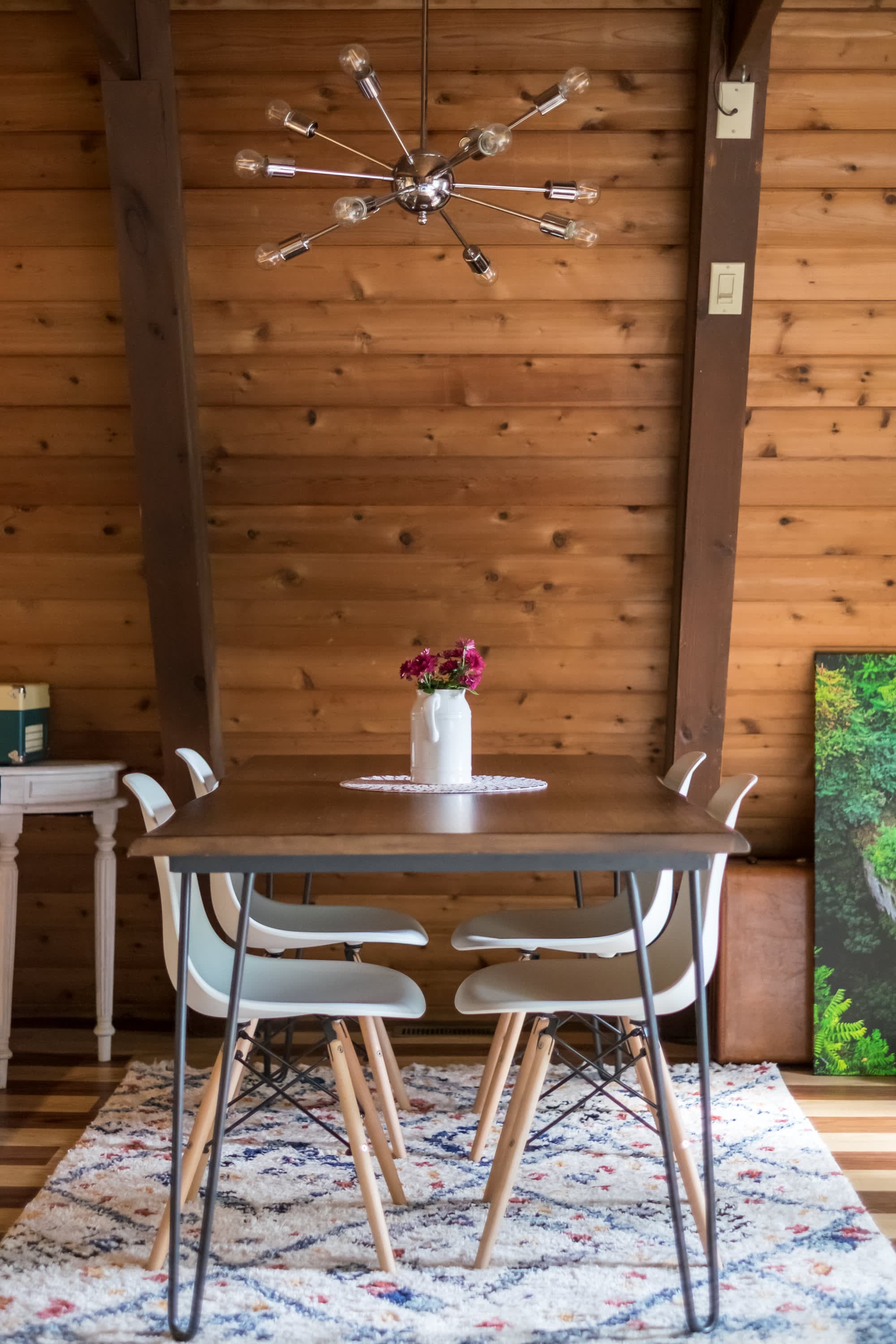 "Cozy cabin dining with modern flair and warm wood charm!"