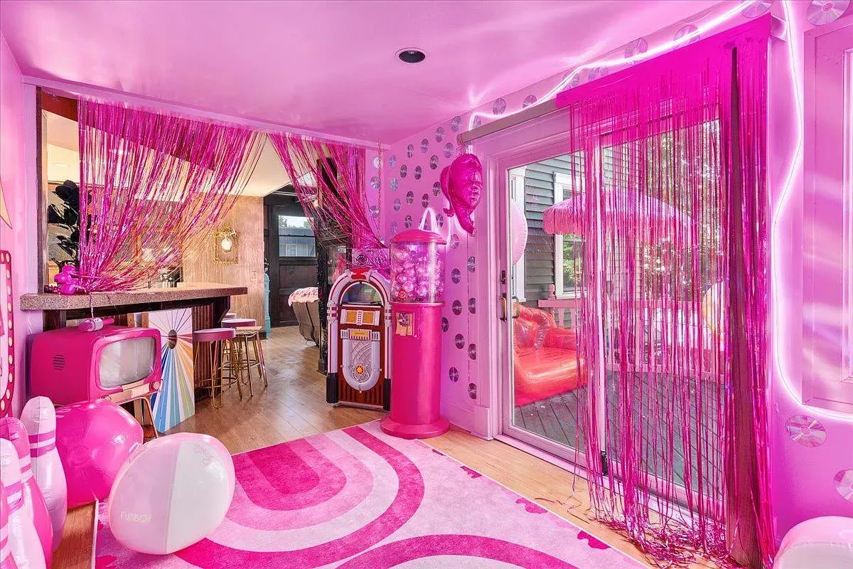## Retro den sparkles with iridescent accents, and the vintage jukebox actually works—cue the sing-along.