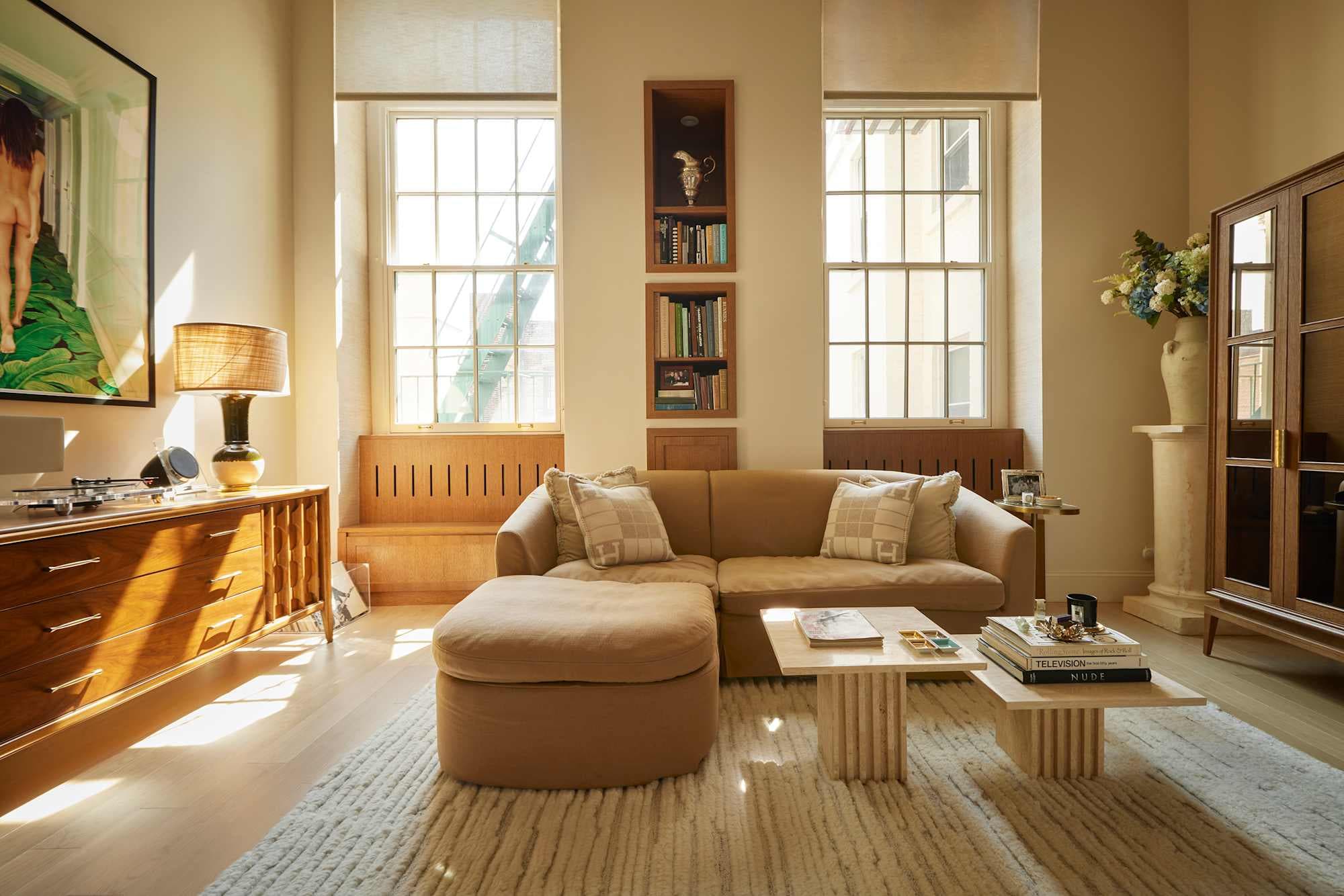 "Sunlit Sanctuary with Mid-Century Charm and Built-in Bookshelves!"