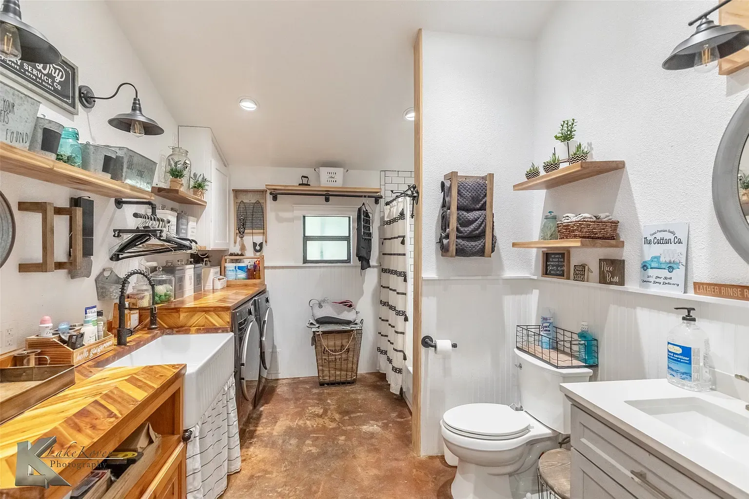 This bath. wood counter plus farmhouse sink. Cute, maybe overdone these days?