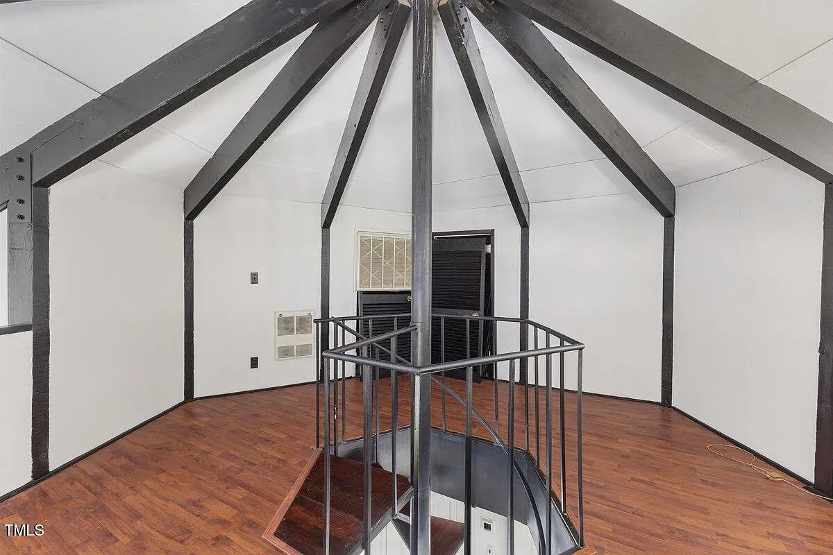 ## Inside the octagonal core, black steel beams vault overhead—modern, a little industrial, and honestly pretty striking