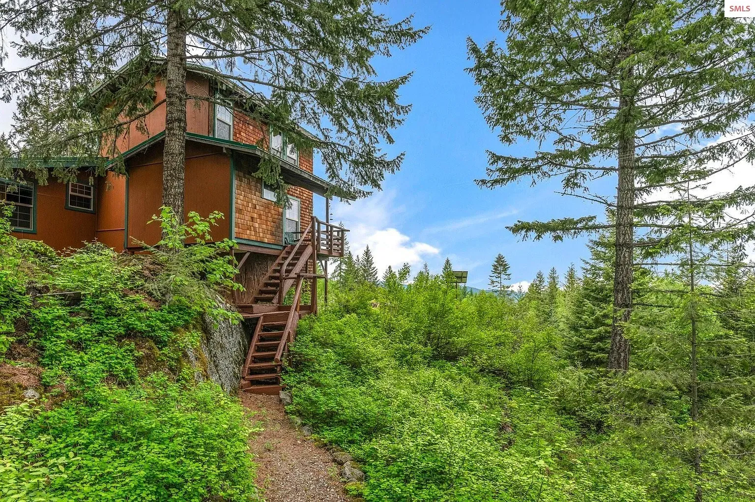 ## Deep orange wood with stone accents—rustic but sharp. Pops against all that green.