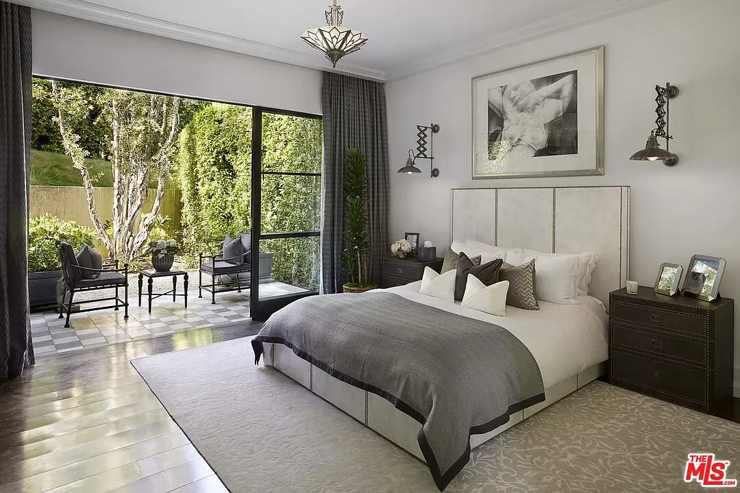 Bedroom goes full grayscale—calm, layered textures. Looks nap-ready.