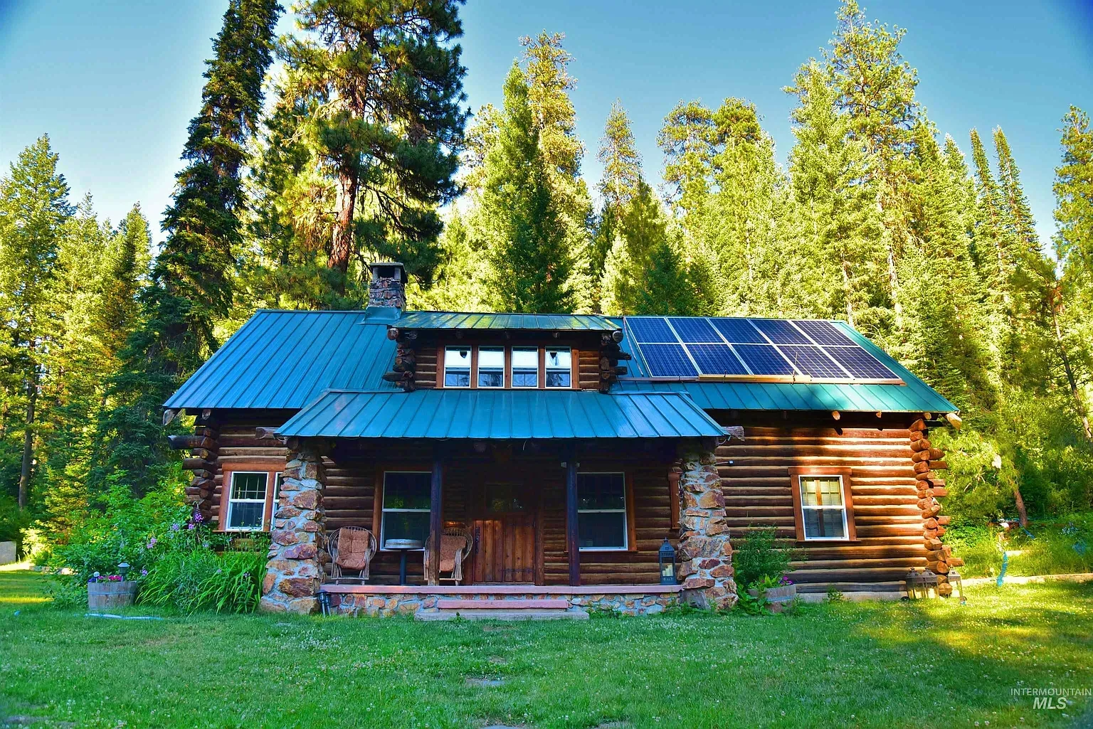 ## Right away, hand-hewn logs mingle with weathered stone—warm, rugged textures soaking up the surrounding pines.