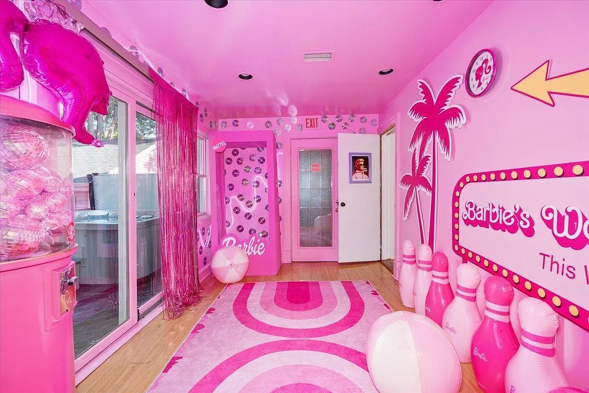 ## Barbie room goes all-in: pink walls, palm graphics, and playful patterns turn it into a themed hangout that’s pure nostalgia.
