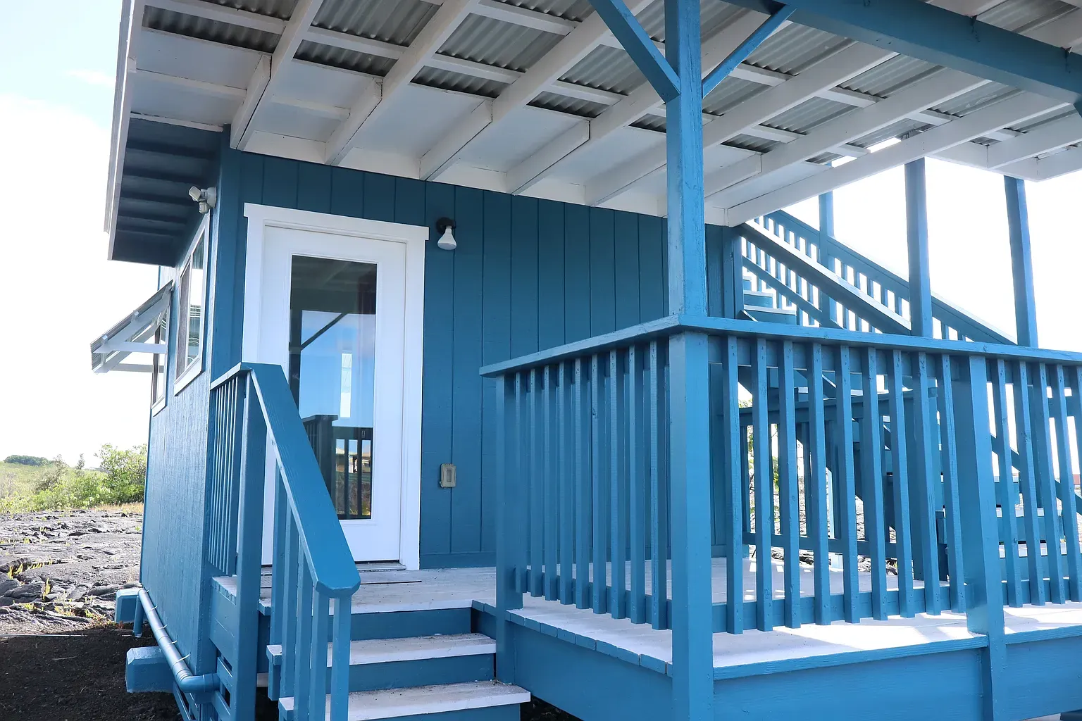 Front steps match the siding. Kinda fun, kinda Smurf house energy.