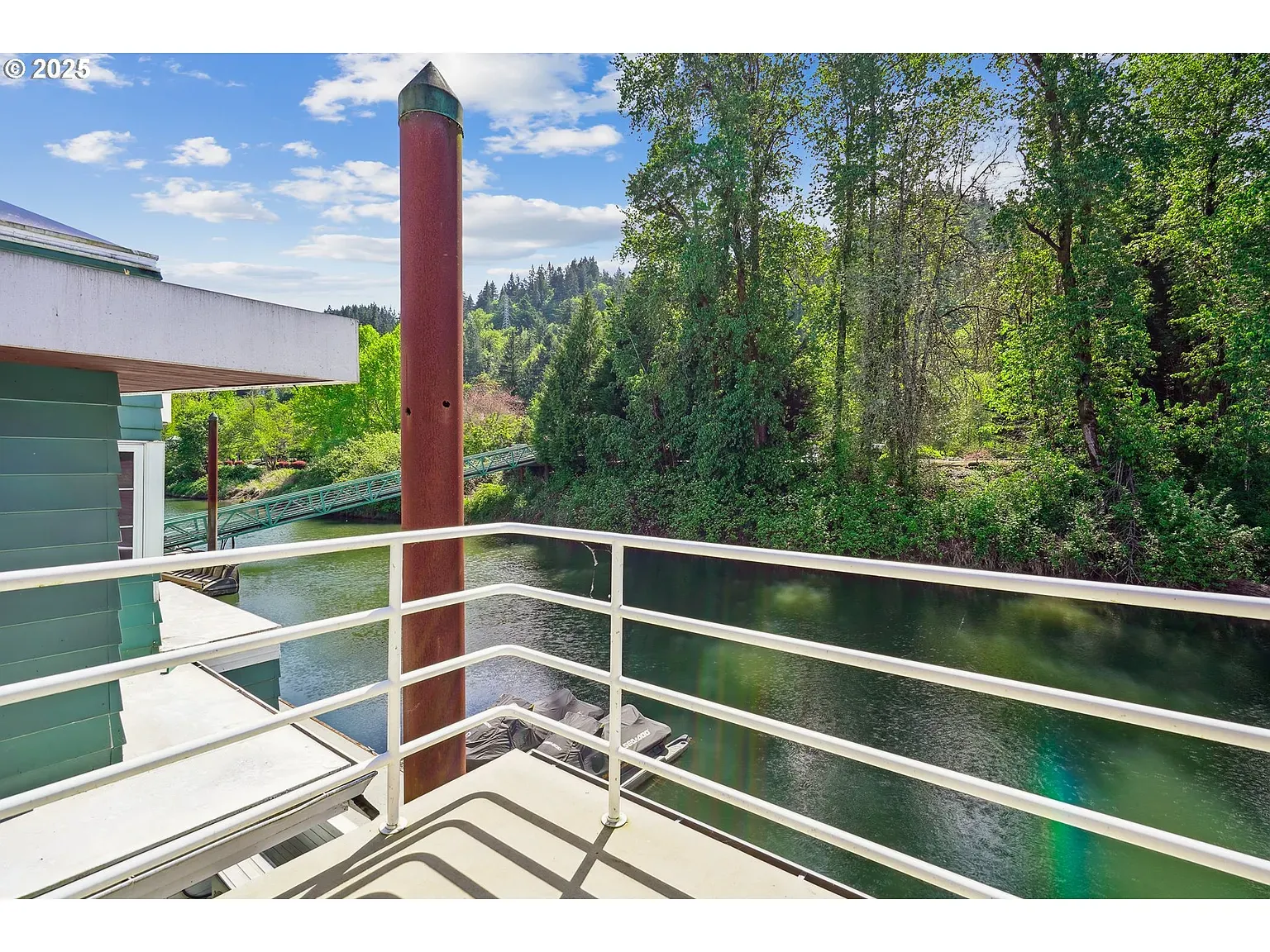 Back outside. river view with sleek railings. From this angle, super clean lines.