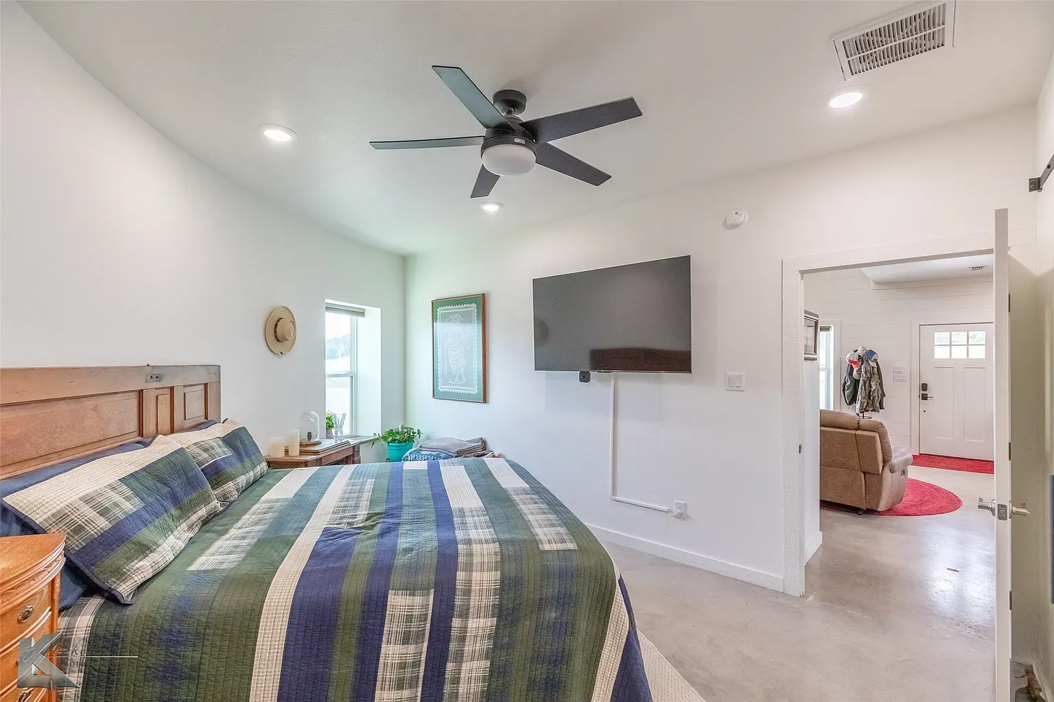Plaid comforter in blues and greens. Chill, slightly lodge-y vibe.