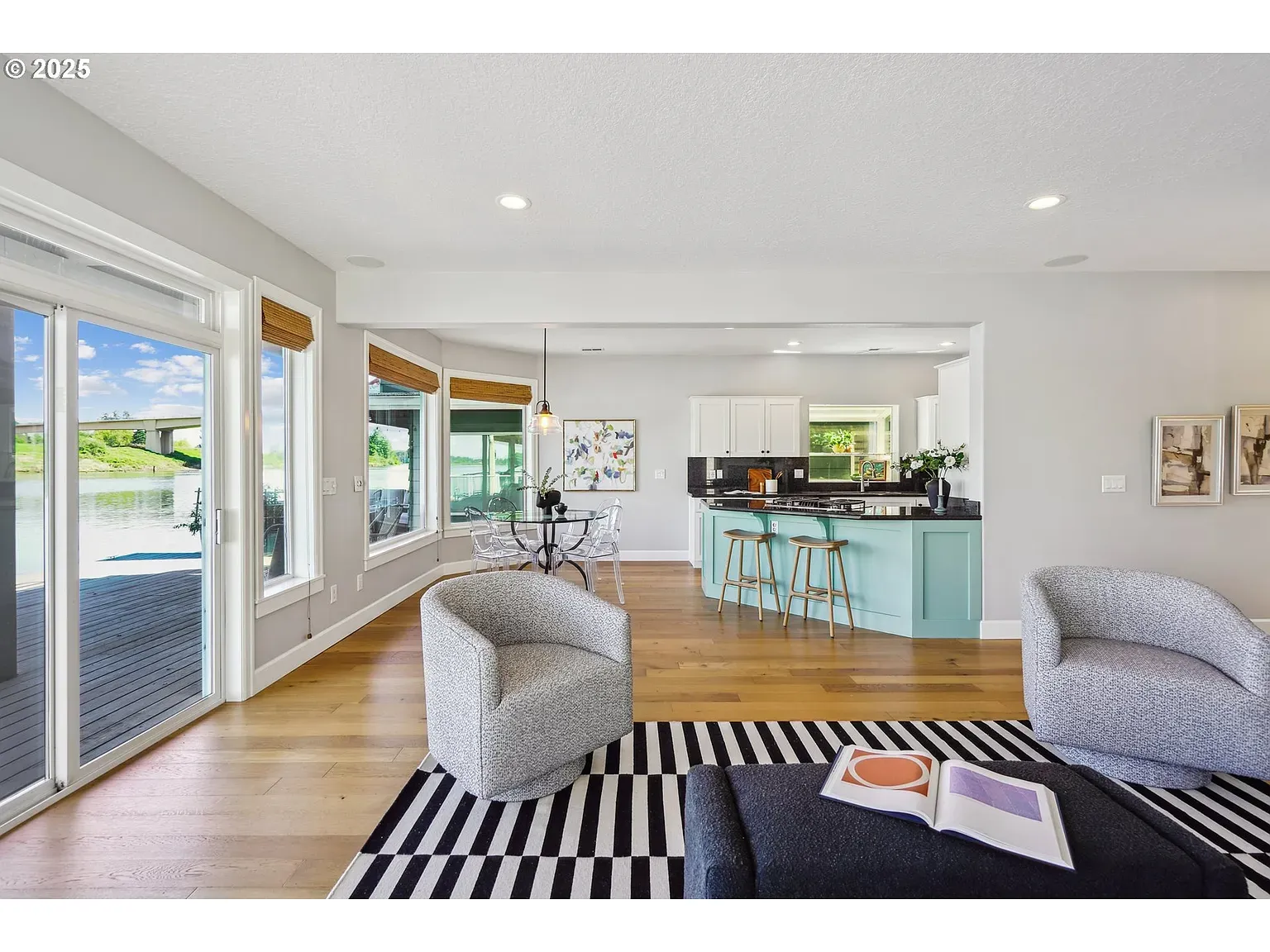 Here's the open living — grays, whites, wood accents. Kinda staged, but comfy.