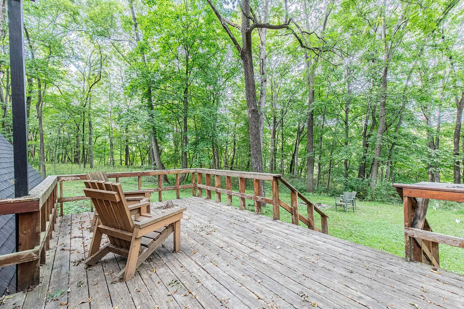 Here's the deck — weathered boards, wide view. Coffee spot secured.