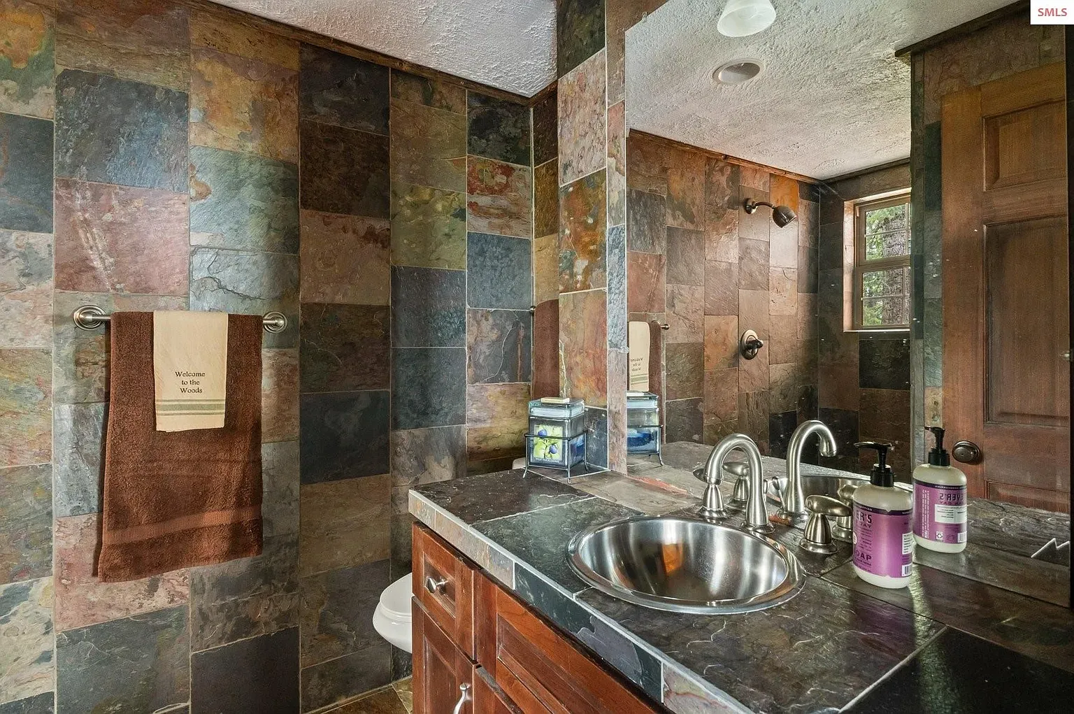## Slate tiles in deep greens and browns with muted gold—earthy, modern, super chill.