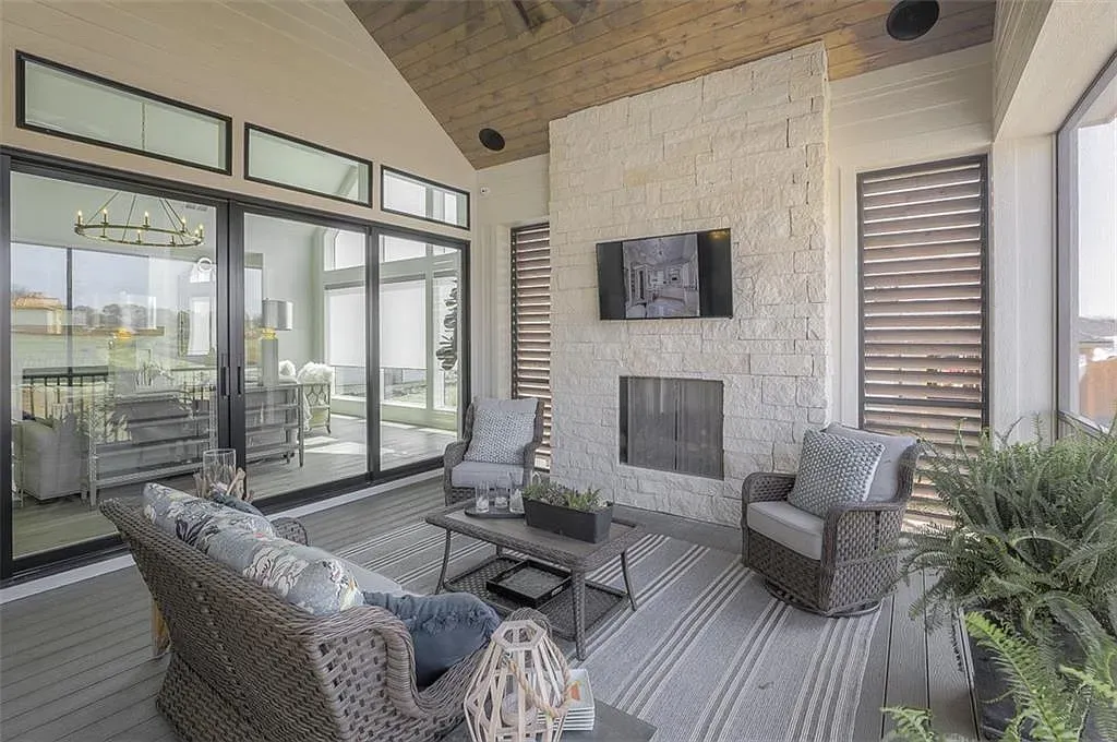 Outdoor room with that stone fireplace—yep, marshmallows and a sweater night.