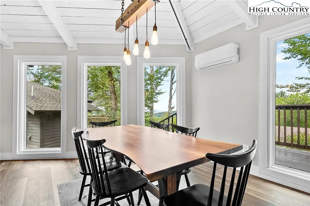 ## Dining gets dramatic with a live-edge table and sleek black chairs—great spot for long meals.
