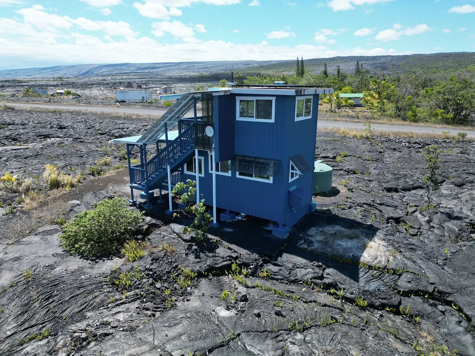 Back outside — blue box on a lava field. Would you actually commit?