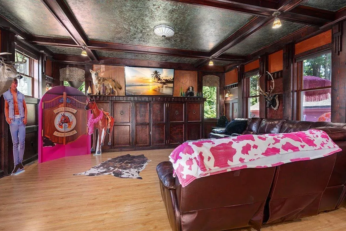 ## Quirky lounge with dark wood paneling and tin-tile ceiling feels classic yet odd in the best way—I like the character here.