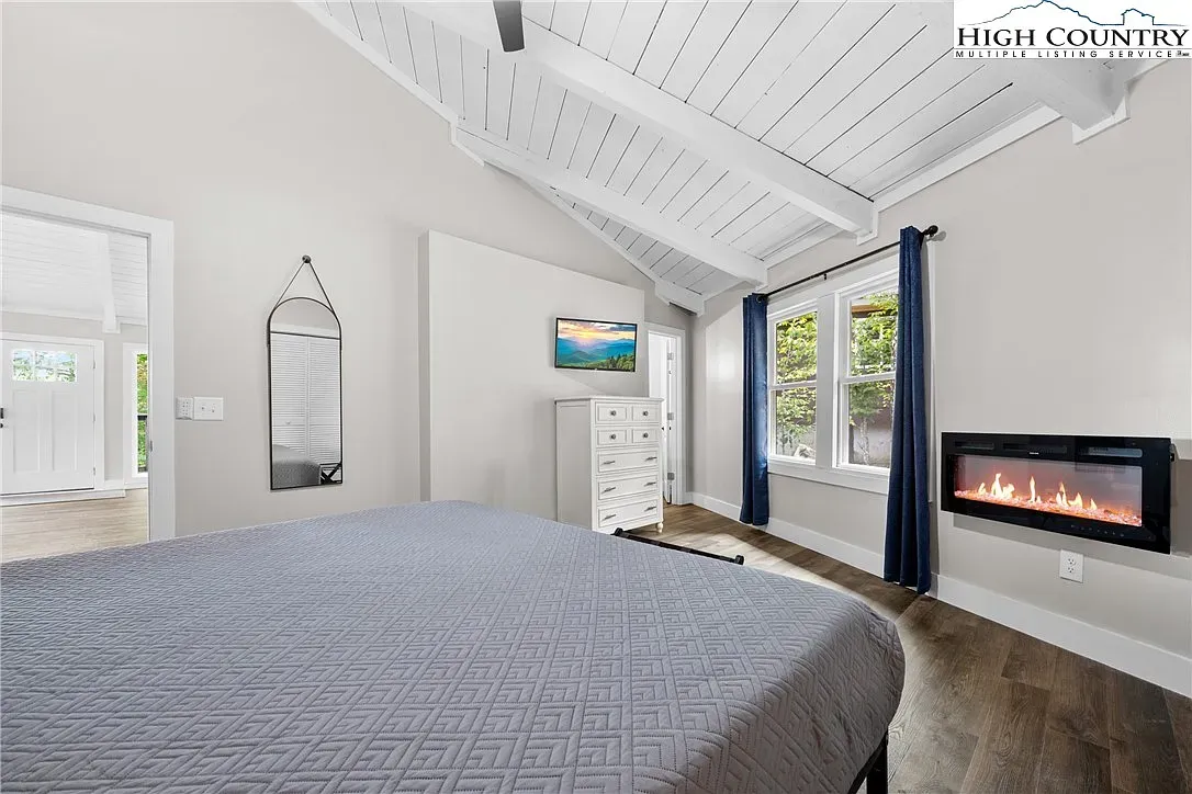 ## I really like this bedroom; vaulted ceiling and white beams make it feel bigger than it is.