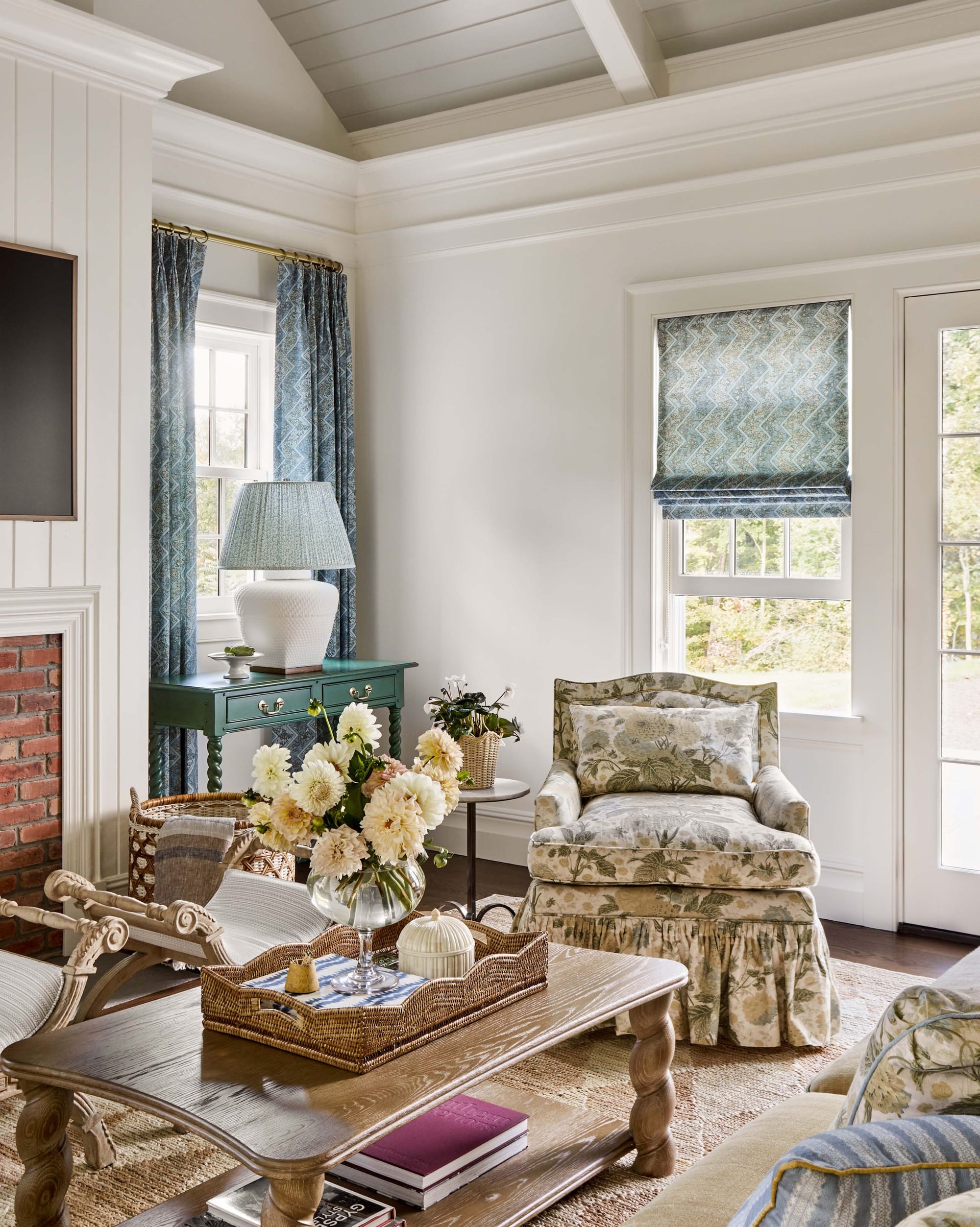 "Charming Cottage Living Room Blends Elegance and Comfort with Stunning Natural Light and Botanical Accents!"