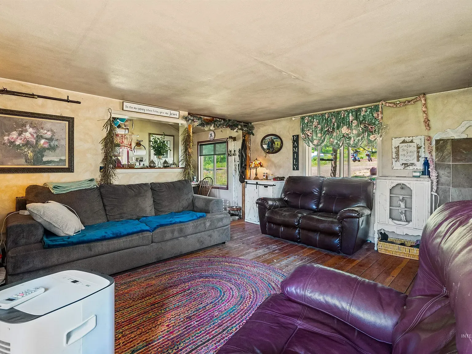 Beige walls with easy light, big plush dark gray seat.