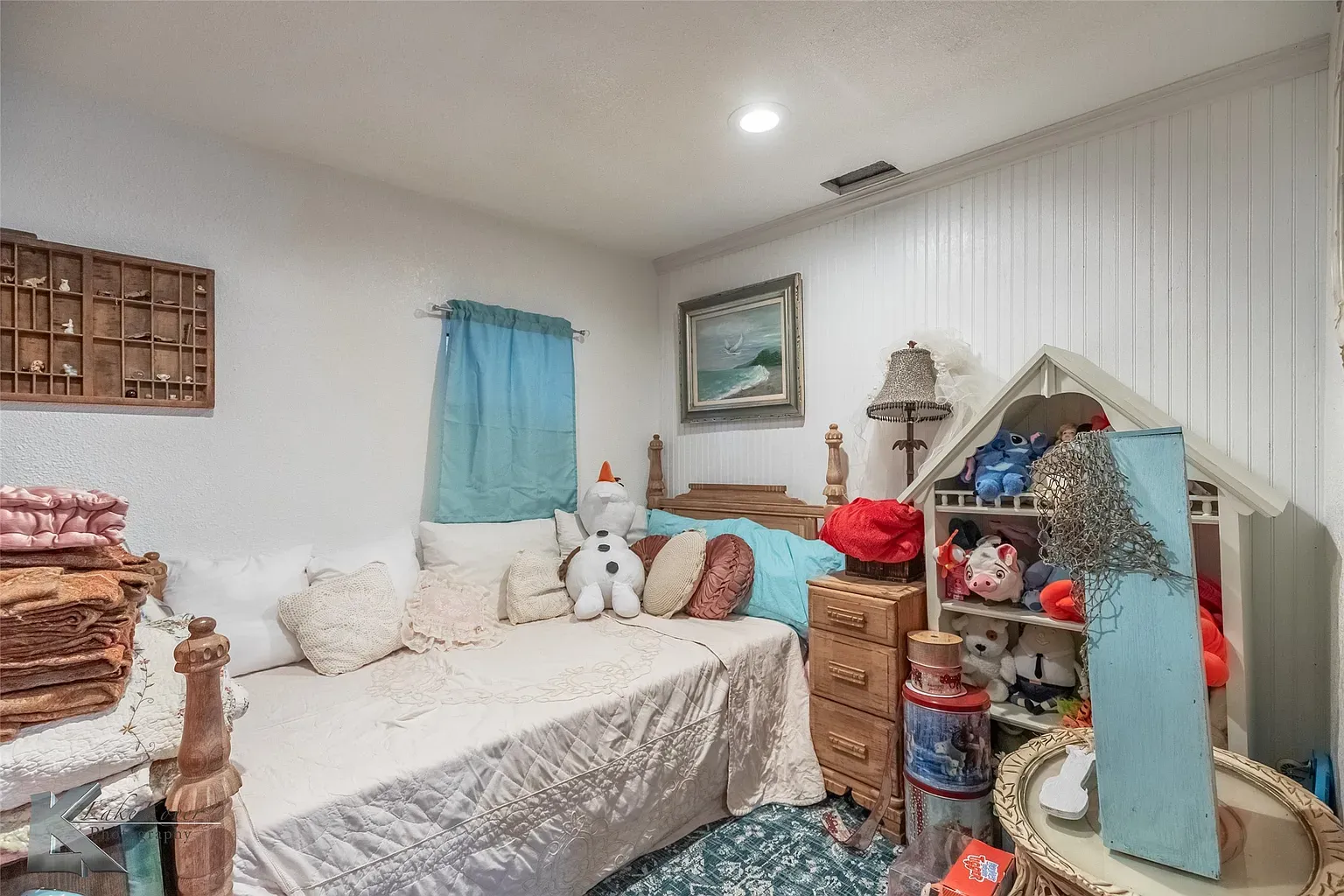 Daybed nook with beadboard. Feels napping at grandma’s lake cabin.