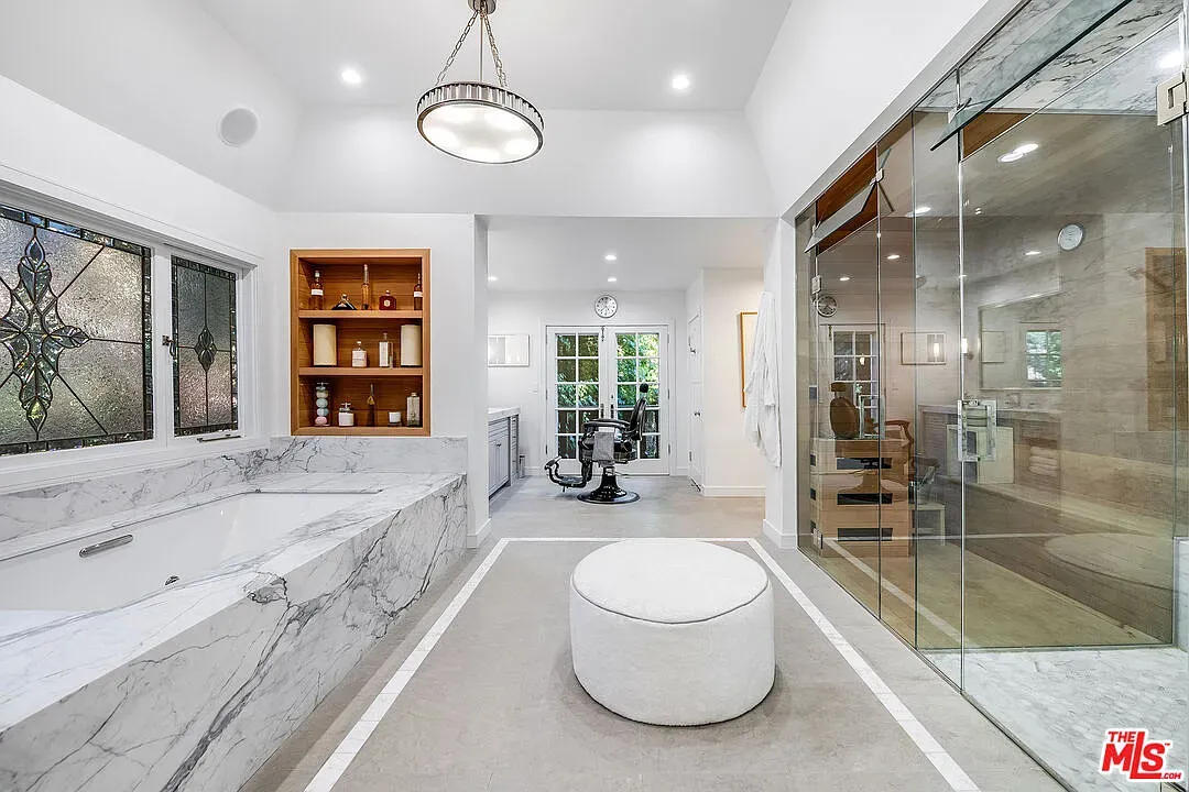 That tub though—solid marble look. Minimal room, maximum soak energy.