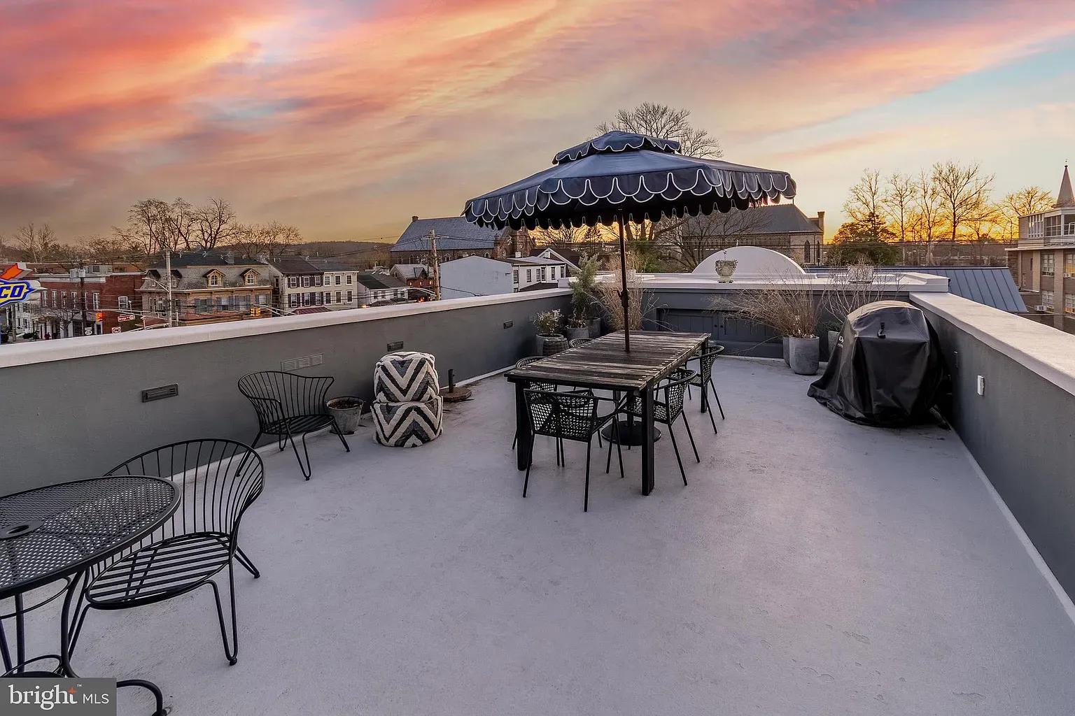 Rooftop. light concrete, clean lines, breezy vibe. Anyone else picturing summer dinners?