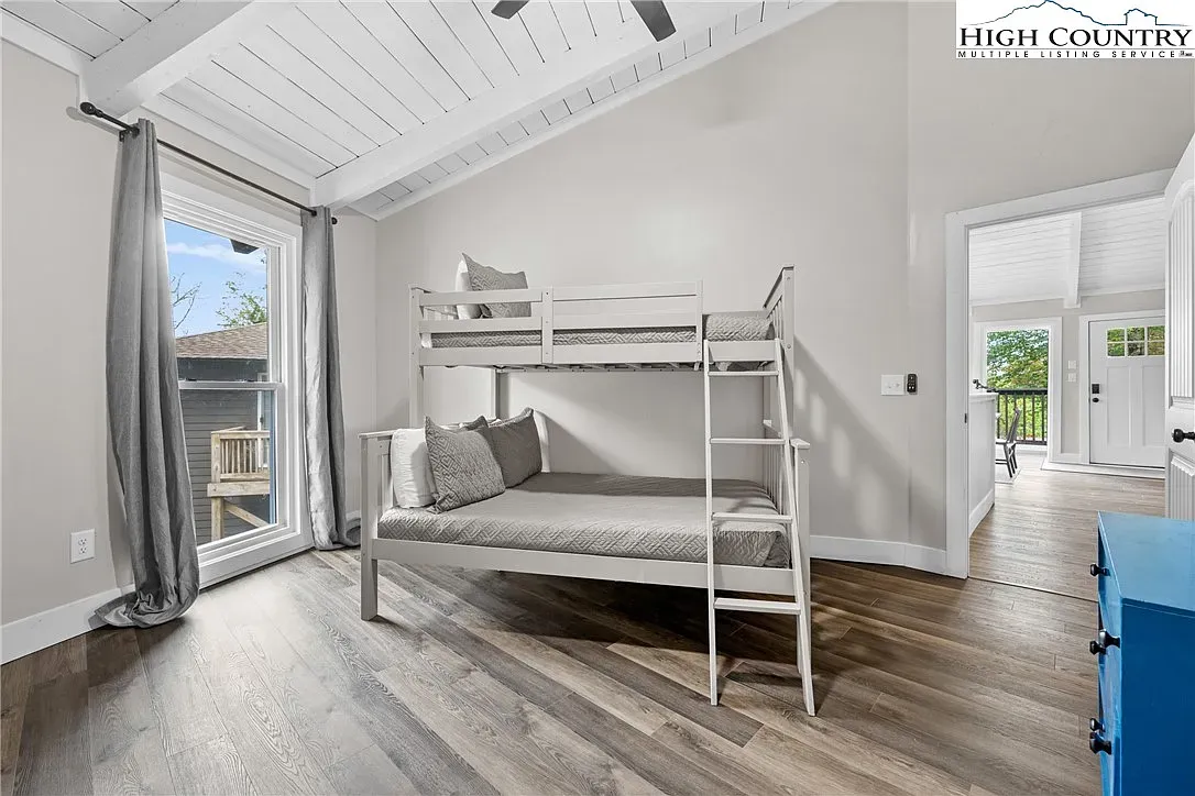 ## The bunk room feels fresh and bright—clean lines, white wood, and plenty of space for sleepovers.