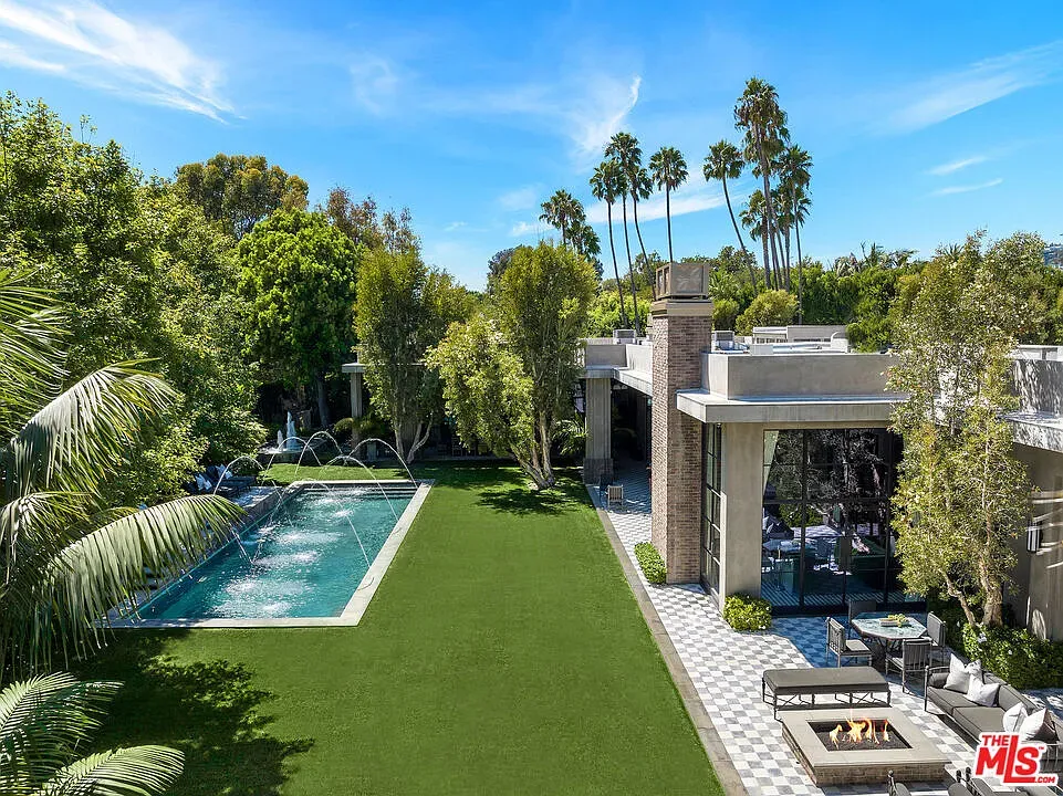 Here's the pool — glassy water, razor-edge lawn. Kinda resort vibes.