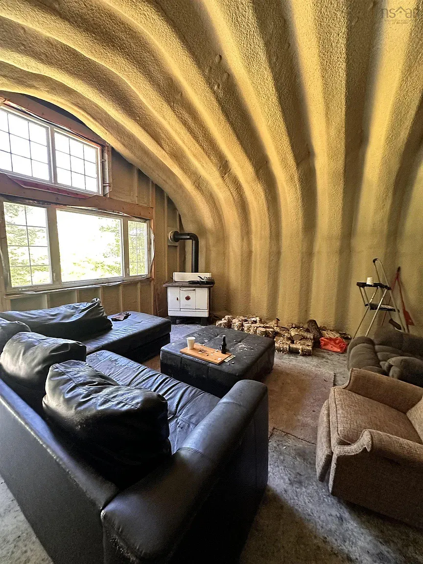 This room goes full cave. Sculpted walls, warm yellow, surprisingly cozy.