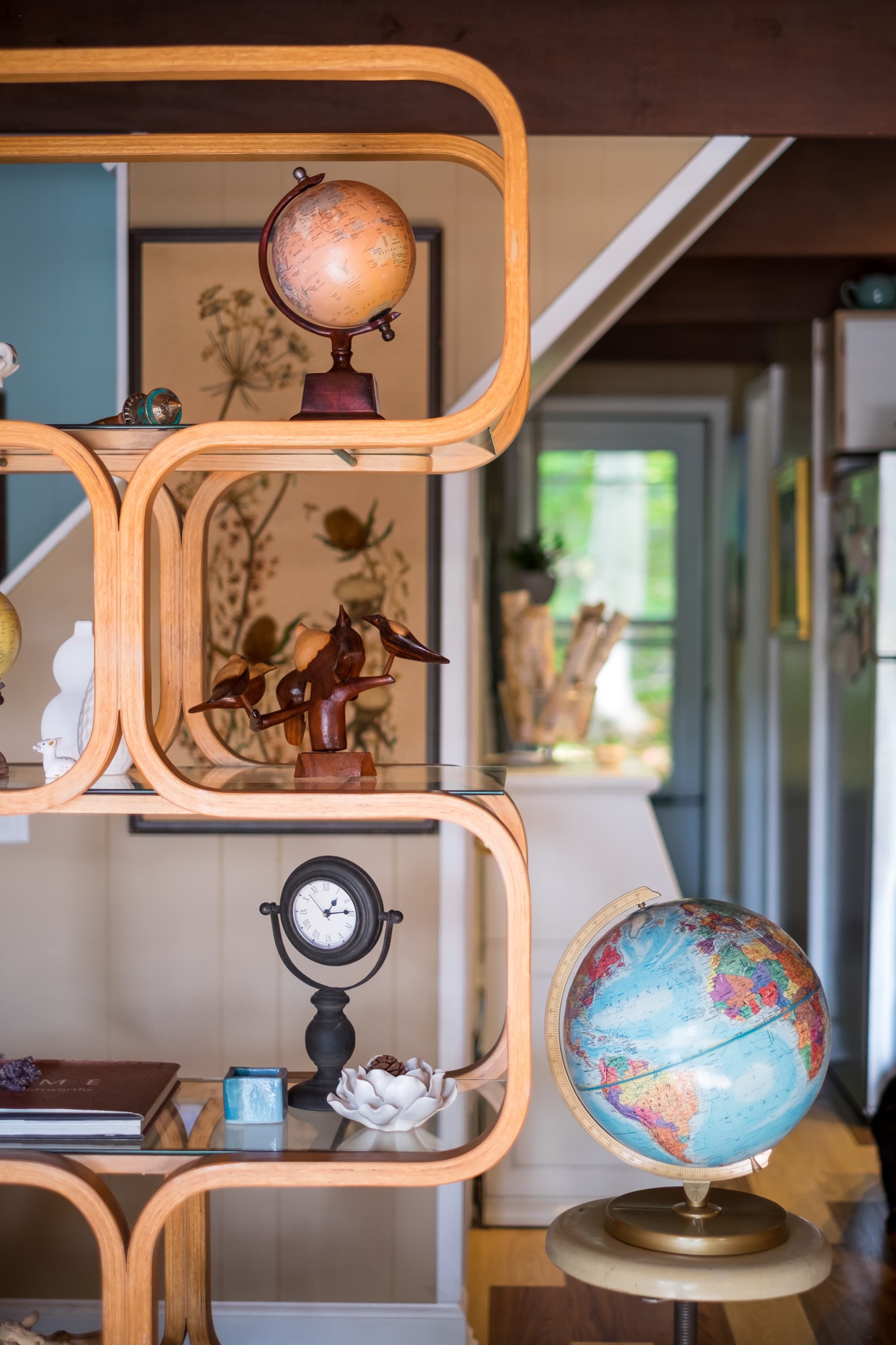 "Globe-trotter's paradise in this stylish mid-century display shelf!"