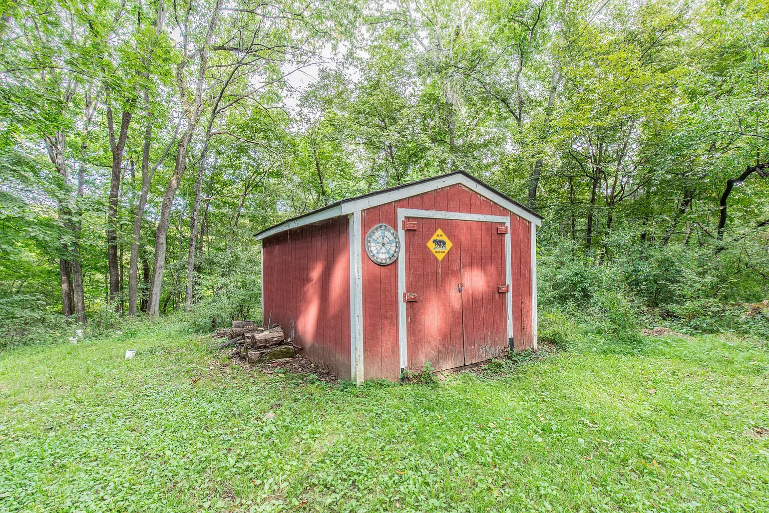 Red shed cameo with a clock. Anyone know why they did this?
