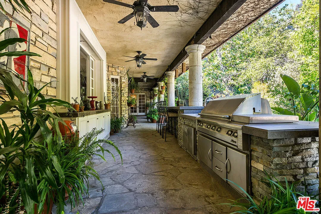 Patio goes earthy stone, then modern comforts. Not sure, but it works.