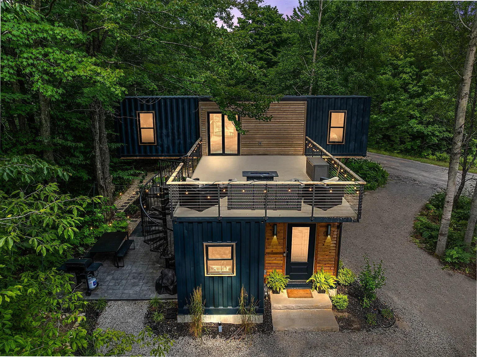 Here's the exterior. blue containers with warm wood. Hidden in trees, very private.