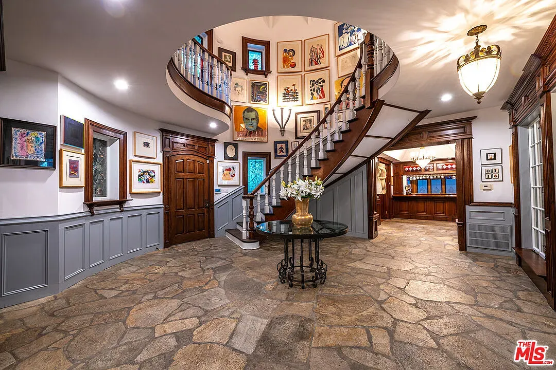 Entry goes round—cobblestone floor a plaza. Anyone know why indoors?