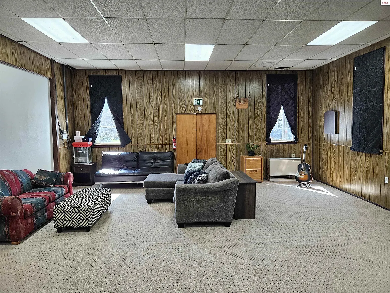 From this angle, the paneling warms it up. Maybe too dark with that couch?