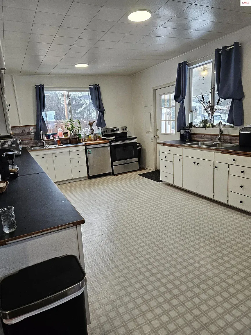 Here's the kitchen—big work zones, soft colors, kinda farmhouse-lite. Too minimal?