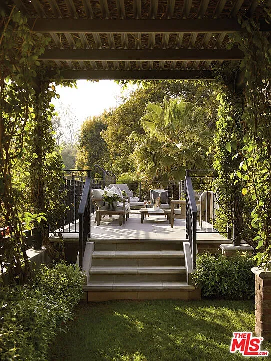 Here’s the viney pergola terrace. Morning coffee spot secured.