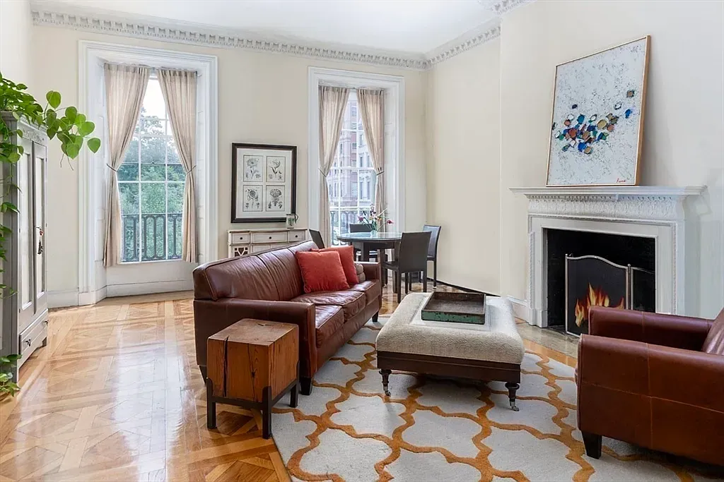 "Cozy up by the elegant fireplace!"