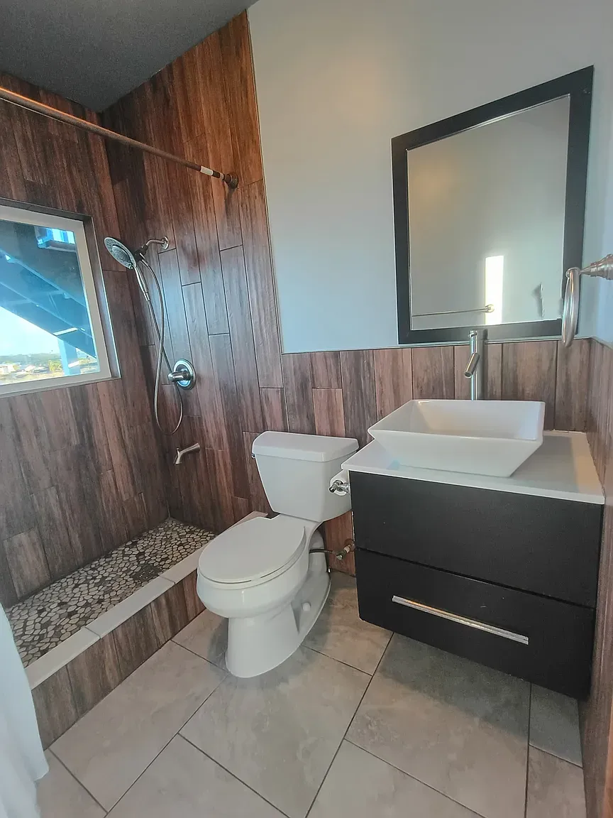 Bathroom flips to wood-and-tile. I mean, it’s cool, maybe a lot?