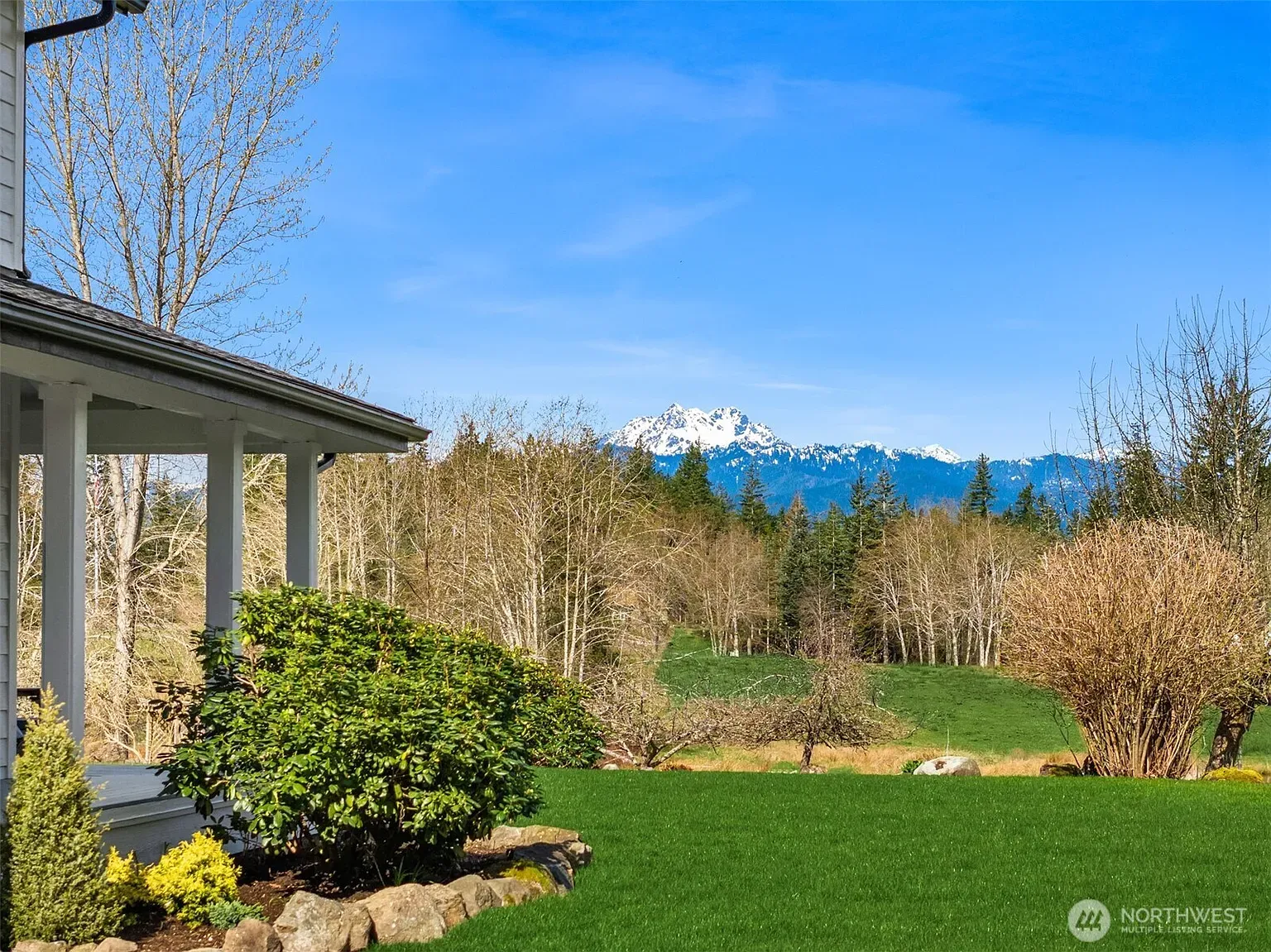 From the house, lawn just rolls out. Left-side pergola peeking in?