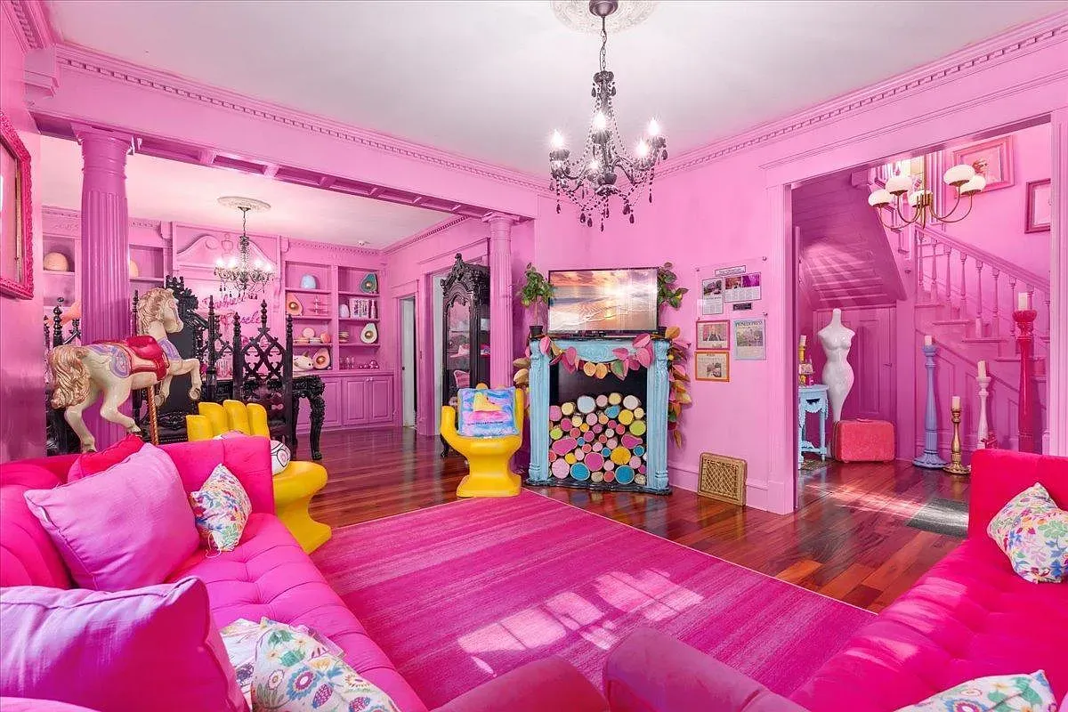 ## Another bubblegum-pink haven radiates creative energy; walls beg for art, craft supplies, or a bold gallery wall.