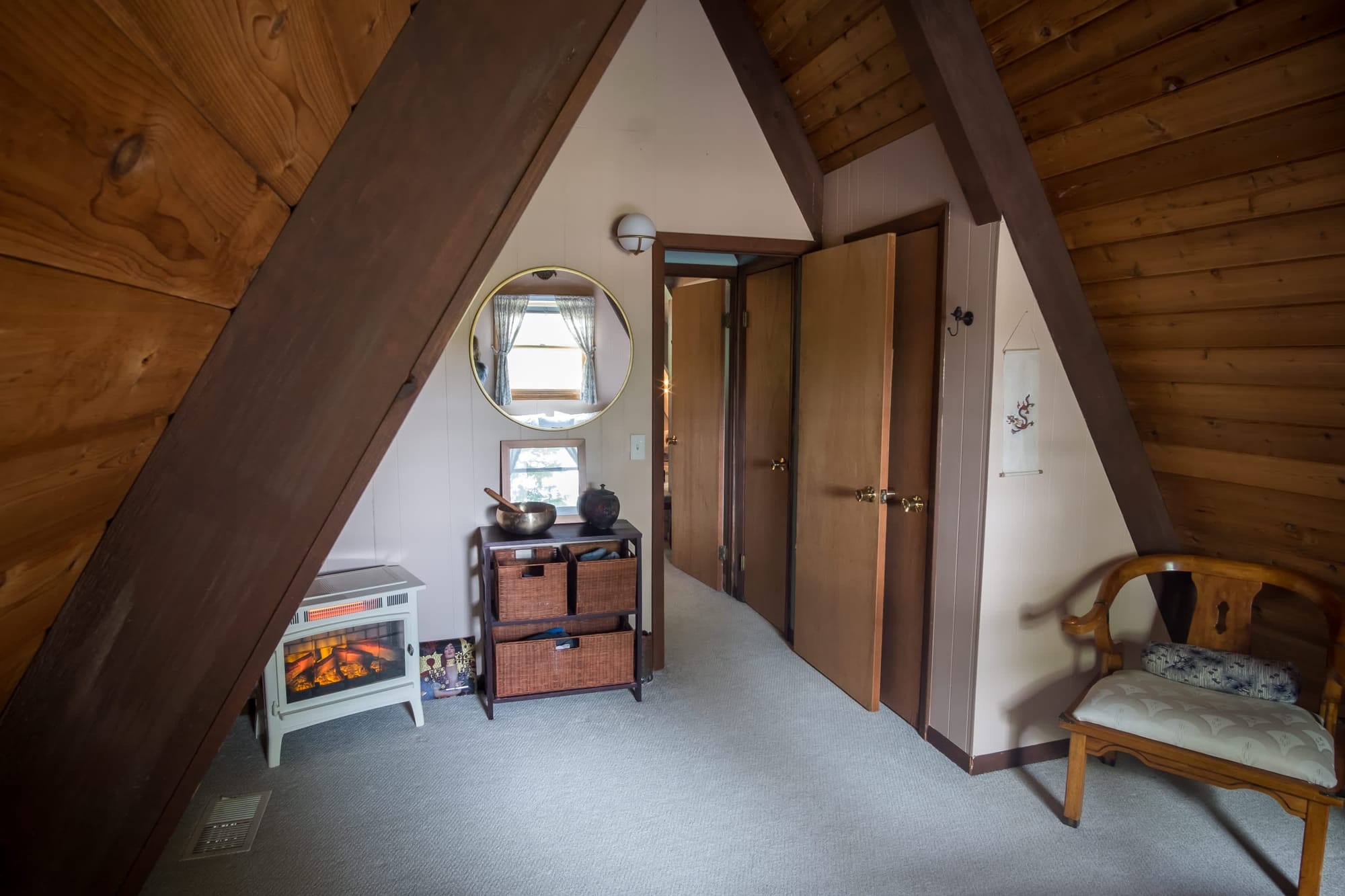"Cozy A-frame retreat with electric fireplace and rustic charm!"