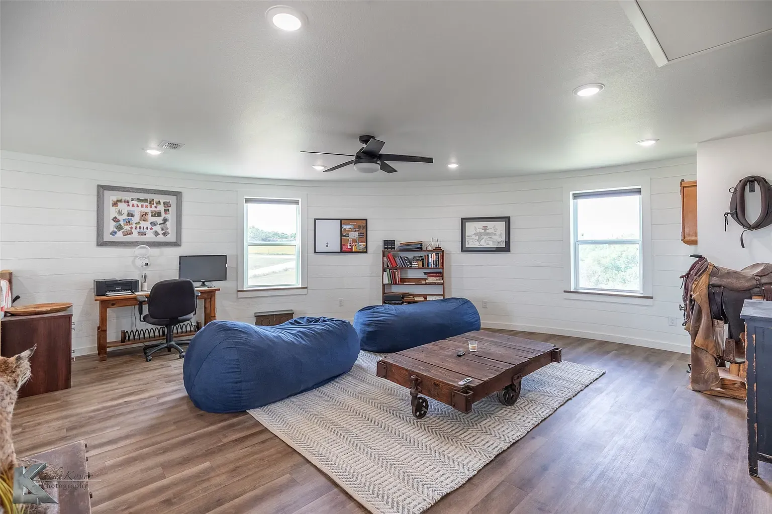 Round room again—white shiplap everywhere, warm floors. Airy and fun.