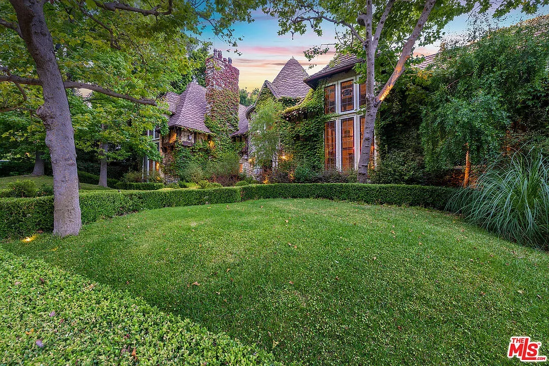 Storybook roofs stacked up, shingles and ivy teaming up. Ridiculously cute.