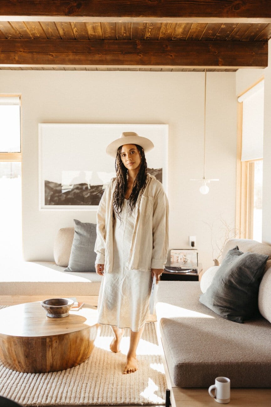 "Desert-inspired minimalism meets warm wooden beams in this serene sanctuary!"