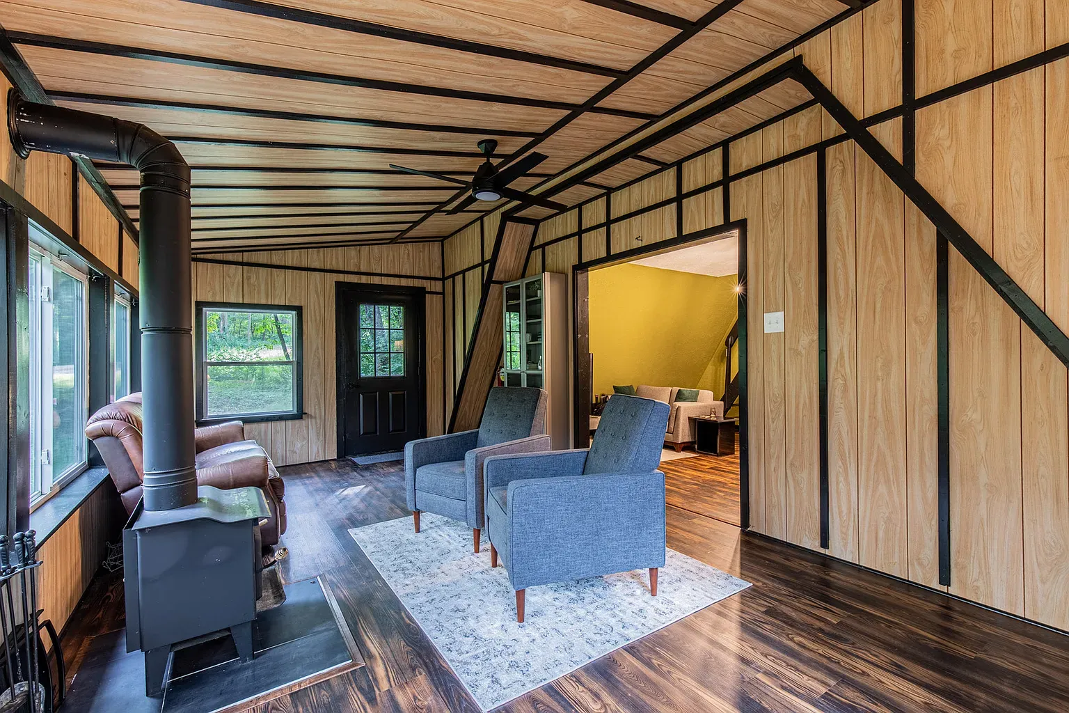 Wood paneling with bold dark trim. Statement lines without feeling fussy.