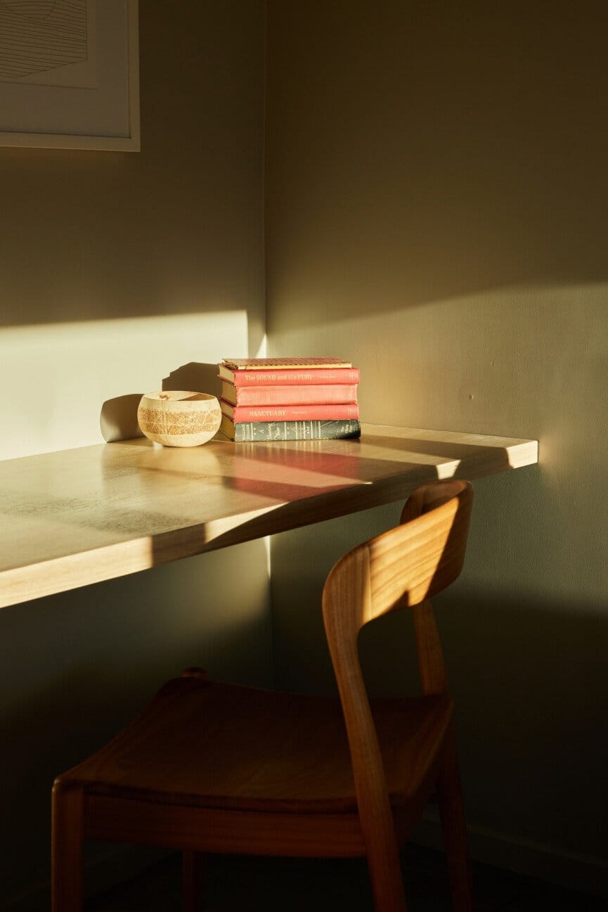 "Cozy reading nook bathed in golden afternoon light."