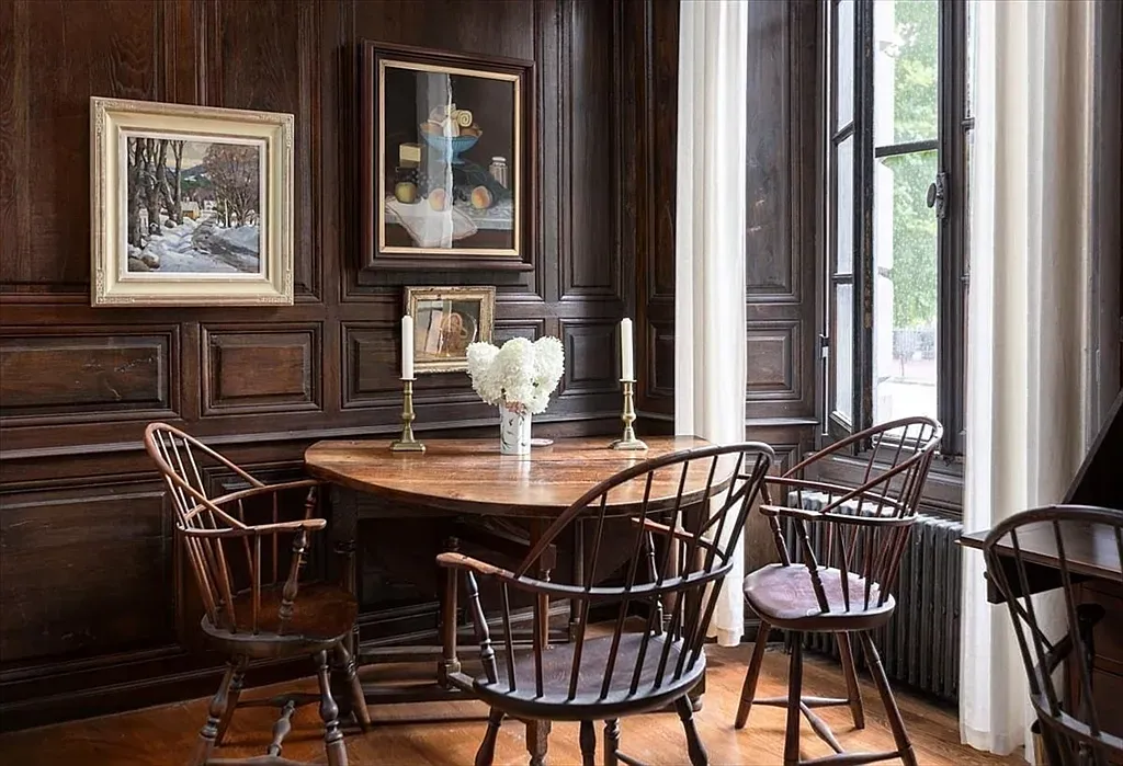 "Cozy dining nook with stunning wood detailing!"