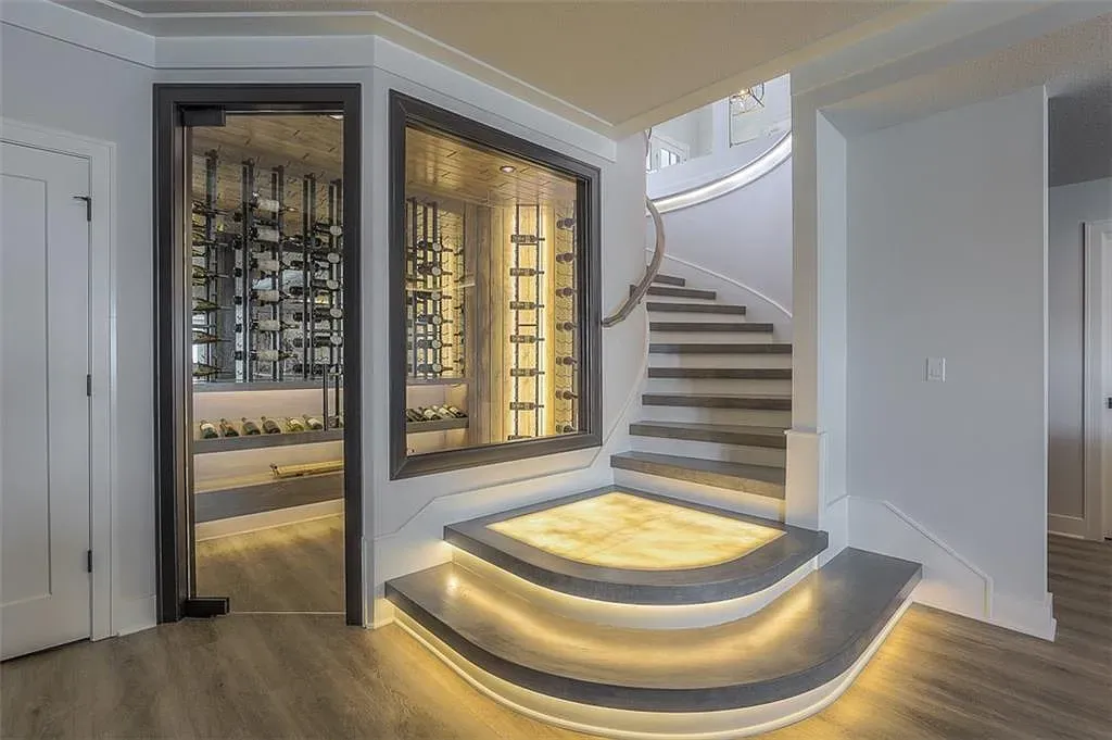 Another curved staircase shot—same vibe. Anyone know why they doubled down on curves?