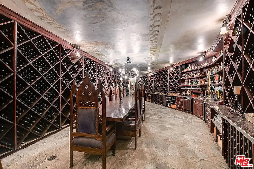 Wine dungeon time—carved racks, diamond stacks. Cool, maybe a bit much.